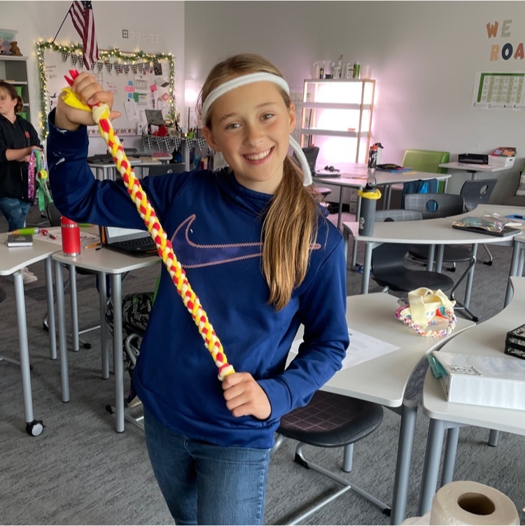 5th graders spreading kindness for kindness day by making dog toys for the animal shelter.